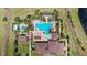 Overhead shot of a clubhouse featuring several pools, a lounge area, and landscaping, set in a tranquil setting at 15946 Marina Bay Dr, Winter Garden, FL 34787