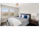 Comfortable bedroom with natural light, plush bedding, and stylish decor at 15946 Marina Bay Dr, Winter Garden, FL 34787