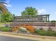 Hawksmoor community sign surrounded by vibrant plants and lush greenery at 15946 Marina Bay Dr, Winter Garden, FL 34787