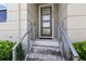 Elegant entryway with a stylish front door and modern railings at 15946 Marina Bay Dr, Winter Garden, FL 34787