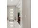 Bright entryway with a modern door, light tile flooring, and a neutral color scheme at 15946 Marina Bay Dr, Winter Garden, FL 34787