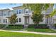 Attractive townhome exterior showcasing lush landscaping and a well-maintained facade at 15946 Marina Bay Dr, Winter Garden, FL 34787