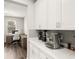 Kitchen featuring sleek white cabinetry and modern stainless steel appliances at 15946 Marina Bay Dr, Winter Garden, FL 34787