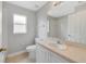 Bathroom featuring a vanity with a large mirror, toilet, and a shower-tub combo at 160 Conch Dr, Kissimmee, FL 34759