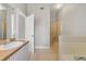 Bathroom with vanity, walk-in shower and soaking tub at 160 Conch Dr, Kissimmee, FL 34759