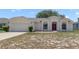 Inviting single-story home with a spacious driveway and a well-maintained lawn at 160 Conch Dr, Kissimmee, FL 34759