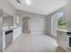 Eat-in kitchen with ample natural light, stainless steel appliances, and white cabinets at 160 Conch Dr, Kissimmee, FL 34759