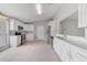 Bright and spacious kitchen featuring new appliances, white cabinetry, and ample counter space at 160 Conch Dr, Kissimmee, FL 34759