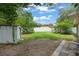 Fenced backyard with shed and young trees at 17 S Aurora Dr, Apopka, FL 32703