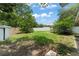 Fenced backyard with shed and young trees at 17 S Aurora Dr, Apopka, FL 32703