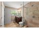 An updated bathroom features a tiled shower, a new vanity, and natural light from the window at 17 S Aurora Dr, Apopka, FL 32703