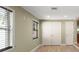 This bedroom features a closet, two windows for natural light, and neutral paint to fit any decor at 17 S Aurora Dr, Apopka, FL 32703