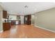 A kitchen featuring stainless steel appliances, wood cabinets with dark countertops, and wood floors at 17 S Aurora Dr, Apopka, FL 32703