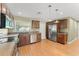 Modern kitchen featuring stainless steel appliances, wood cabinets, and plenty of counter space at 17 S Aurora Dr, Apopka, FL 32703