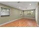 Living room features wood floors, recessed lighting, and multiple windows for natural light at 17 S Aurora Dr, Apopka, FL 32703