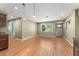 Bright living room featuring wood floors, a window view, recessed lighting, and neutral paint colors at 17 S Aurora Dr, Apopka, FL 32703