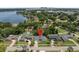 Charming single-story home with a lush yard and a refreshing private pool, nestled near a scenic lake at 217 Spencer St, Orlando, FL 32839