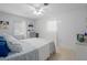 Bright bedroom featuring a cozy bed, windows, and neutral decor at 217 Spencer St, Orlando, FL 32839