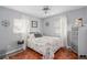 Cozy bedroom featuring a comfortable bed, windows, and decorative accents at 217 Spencer St, Orlando, FL 32839