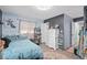 Stylish bedroom with a large bed, modern storage, an area rug, and soft lighting at 217 Spencer St, Orlando, FL 32839