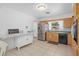 Bright kitchen with stainless steel appliances, light wood cabinets, tiled floors, and a view out the window at 217 Spencer St, Orlando, FL 32839