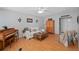Bright living room featuring hardwood floors, a piano, and a comfortable sofa with decorative pillows at 217 Spencer St, Orlando, FL 32839