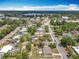 Aerial view showcasing the neighborhood and nearby lake, emphasizing the desirable location at 221 Golden Days Dr, Casselberry, FL 32707