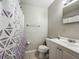 Cozy bathroom featuring a shower-tub combo with white vanity and neutral wall color at 221 Golden Days Dr, Casselberry, FL 32707