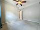 Bedroom featuring a ceiling fan, gray walls and neutral carpeting at 221 Golden Days Dr, Casselberry, FL 32707