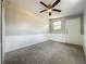 Spacious bedroom with wainscoting, carpet, and ceiling fan, offering a comfortable retreat at 221 Golden Days Dr, Casselberry, FL 32707