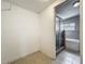 Empty closet space with light tile flooring visible from the bathroom at 221 Golden Days Dr, Casselberry, FL 32707