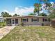 Charming single-story home with a well-manicured lawn and a screened-in porch, offering a cozy curb appeal at 221 Golden Days Dr, Casselberry, FL 32707