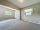 Cozy living room with abundant natural light and comfortable carpeting, creating a warm atmosphere at 221 Golden Days Dr, Casselberry, FL 32707