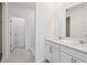 Modern bathroom with double vanity, quartz countertop, and tiled shower at 2502 Linda Knoll Ln, Bartow, FL 33830