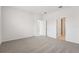 Spacious bedroom with neutral carpet, two doorways, and ample natural light at 2502 Linda Knoll Ln, Bartow, FL 33830
