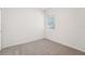 Cozy bedroom featuring plush carpeting, a bright window, and fresh white walls at 2502 Linda Knoll Ln, Bartow, FL 33830