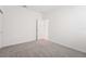 A pristine bedroom with neutral walls, plush carpeting, and a welcoming doorway at 2502 Linda Knoll Ln, Bartow, FL 33830