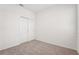 A bright bedroom featuring plush carpeting, a window with blinds, and a spacious closet at 2502 Linda Knoll Ln, Bartow, FL 33830
