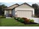 Charming single-story home with a neutral color palette, stone accents, and well-manicured landscaping at 2502 Linda Knoll Ln, Bartow, FL 33830