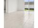 Bright living area featuring tile floors and sliding glass doors for ample natural light at 2502 Linda Knoll Ln, Bartow, FL 33830