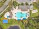 Aerial view of the community pool, clubhouse, playground and surrounding landscaping at 2528 Double Tree Pl, Oviedo, FL 32766