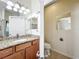 Well-lit bathroom featuring granite countertops and a matching backsplash at 2528 Double Tree Pl, Oviedo, FL 32766
