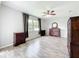 Comfortable bedroom with wood-look flooring, a ceiling fan, and lots of natural light at 2528 Double Tree Pl, Oviedo, FL 32766