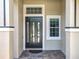 This home has a stylish black front door with decorative windows and brick pavers at 2528 Double Tree Pl, Oviedo, FL 32766