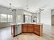 Open-concept kitchen with granite countertops, stainless steel appliances, and an island with pendant lighting at 2528 Double Tree Pl, Oviedo, FL 32766