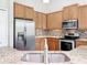 Beautiful kitchen with stainless steel appliances and granite countertops at 2528 Double Tree Pl, Oviedo, FL 32766