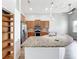 Modern kitchen with granite countertops, stainless appliances, wooden cabinets and recessed lighting at 2528 Double Tree Pl, Oviedo, FL 32766