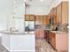 Modern kitchen featuring stainless appliances, wood cabinets, granite countertops and eat in area at 2528 Double Tree Pl, Oviedo, FL 32766