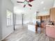 Open floorplan with kitchen view, stainless steel appliances, and hardwood floors at 2528 Double Tree Pl, Oviedo, FL 32766