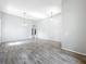 Bright living room featuring wood floors and modern light fixtures at 2528 Double Tree Pl, Oviedo, FL 32766